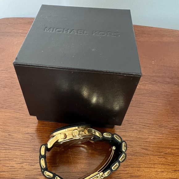 Michael Kors black and gold women’s watch